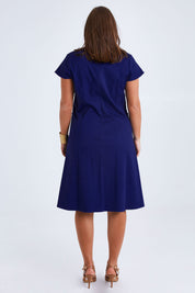 Model Monique wearing size 14 of the Belle A Line Cotton Sateen Dress in colour Sapphire (Blue), from the back