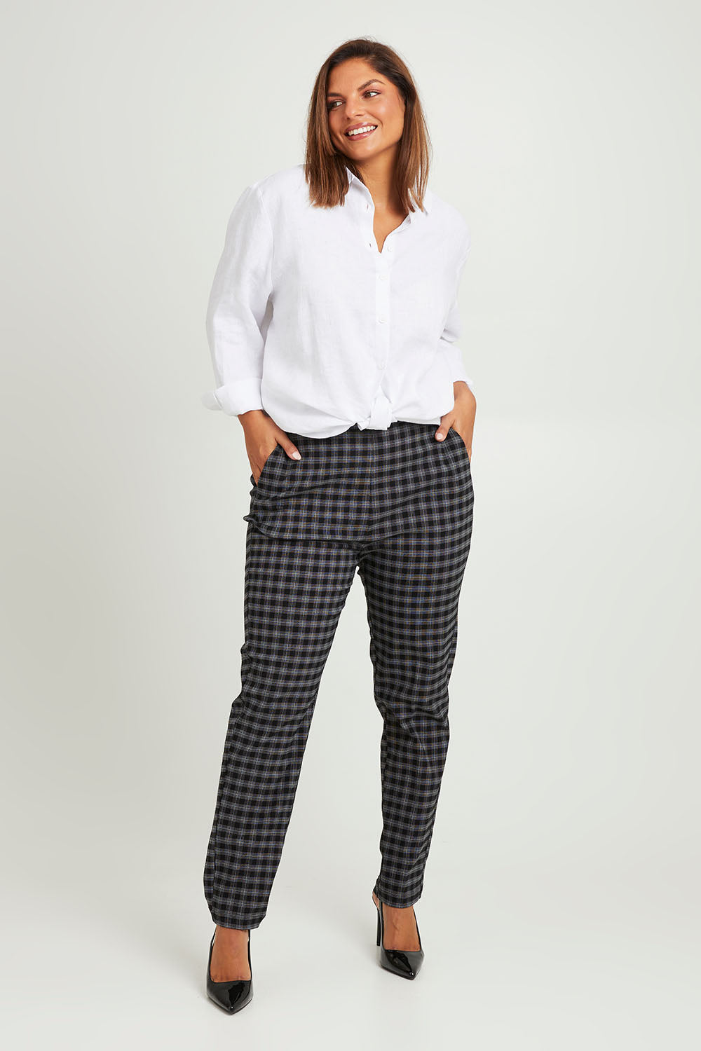Model Monique wearing size 14 of the Belle Check Pull on Pant in colour Blackwhite (Black), from the front, showing the whole outfit