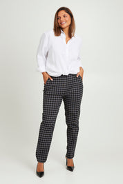 Model Monique wearing size 14 of the Belle Check Pull on Pant in colour Blackwhite (Black), from the front, showing the whole outfit