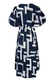 Product shot of the Belle Printed Twist Knot Detail Cotton Dress in colour Bluegeo (Blue), from the back