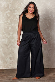Model Ashleigh wearing size 14 of the Belle Luxe Cotton Tank in colour Black (Black), from the front, showing the whole outfit
