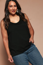 Model Ashleigh wearing size 16 of the Belle Luxe Cotton Tank in colour Black (Black), from the front, showing the whole outfit