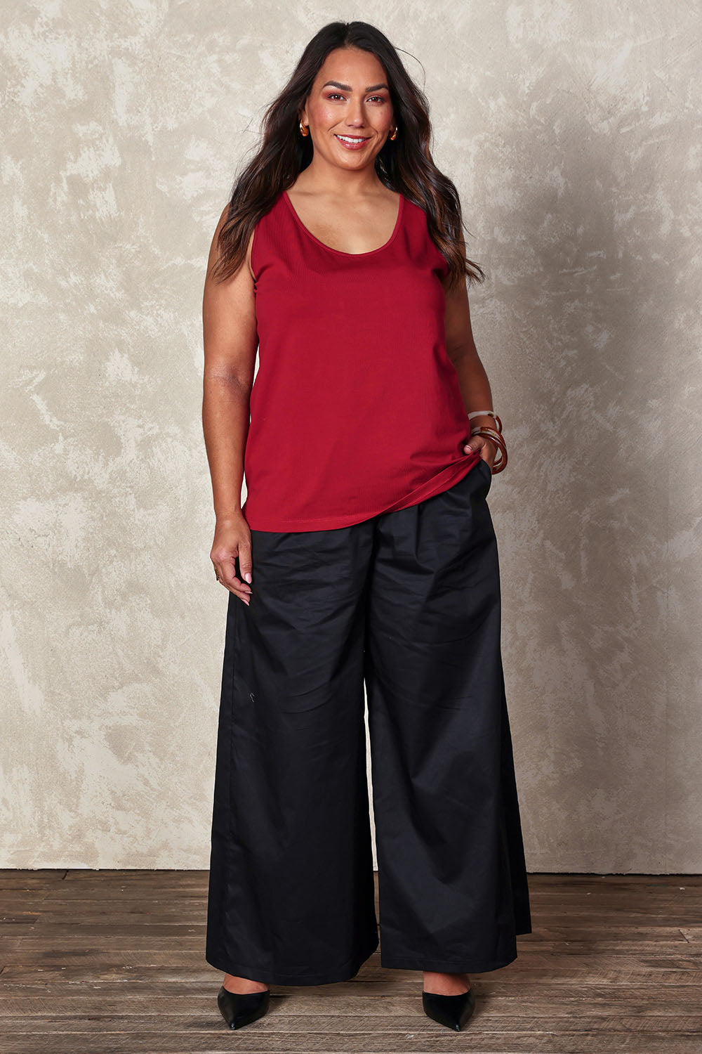 Model Ashleigh wearing size 16 of the Belle Luxe Cotton Tank in colour Chilli (Red), from the front, showing the whole outfit