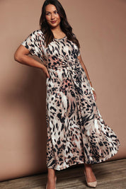 Model Ashleigh wearing size 16 of the Belle Printed Rouched Maxi Dress in colour Leopard, from the front, showing the whole outfit