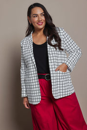 Model Ashleigh wearing size 16 of the Belle Printed Cotton Blazer in colour Whiteblack (White), from the front, cropped image