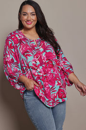 Model Ashleigh wearing size 16 of the Belle Printed Full Sleeve Shirt in colour Aquafusch (Pink), from the front, cropped image