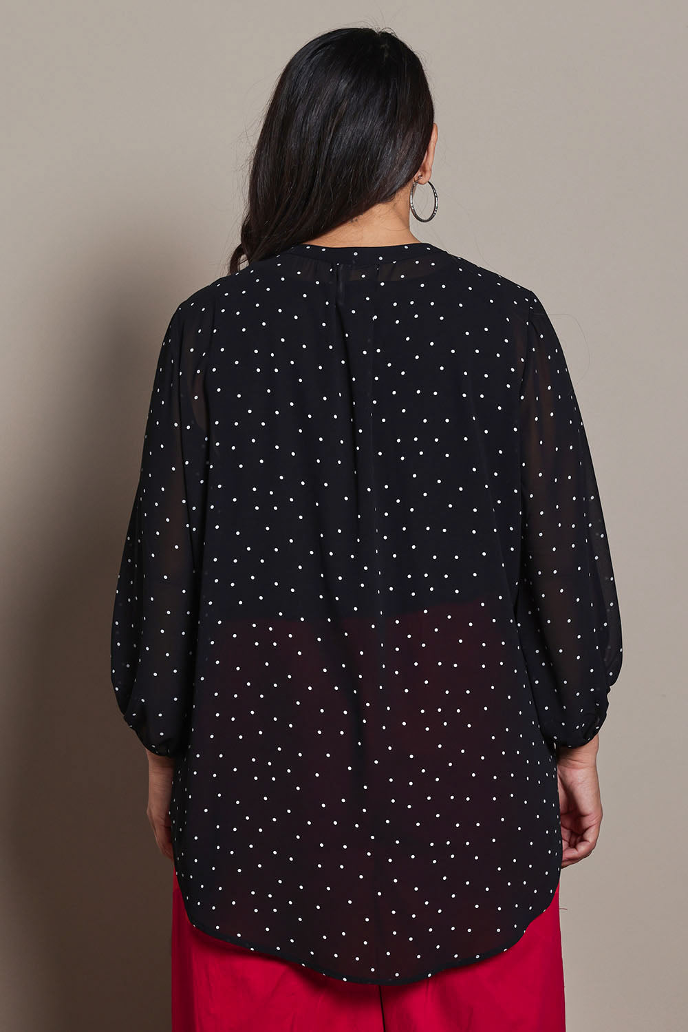 Model Ashleigh wearing size 16 of the Belle Printed Full Sleeve Shirt in colour Blackwhite (Black), from the back