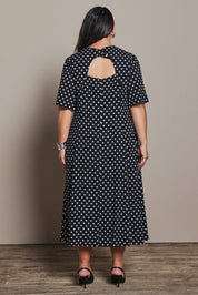 Model Ashleigh wearing size 16 of the Belle Fluted A Line Dress With Pockets in colour Blackwhite (Black), from the back