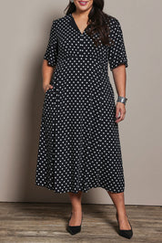 Model Ashleigh wearing size 16 of the Belle Fluted A Line Dress With Pockets in colour Blackwhite (Black), from the front, cropped image
