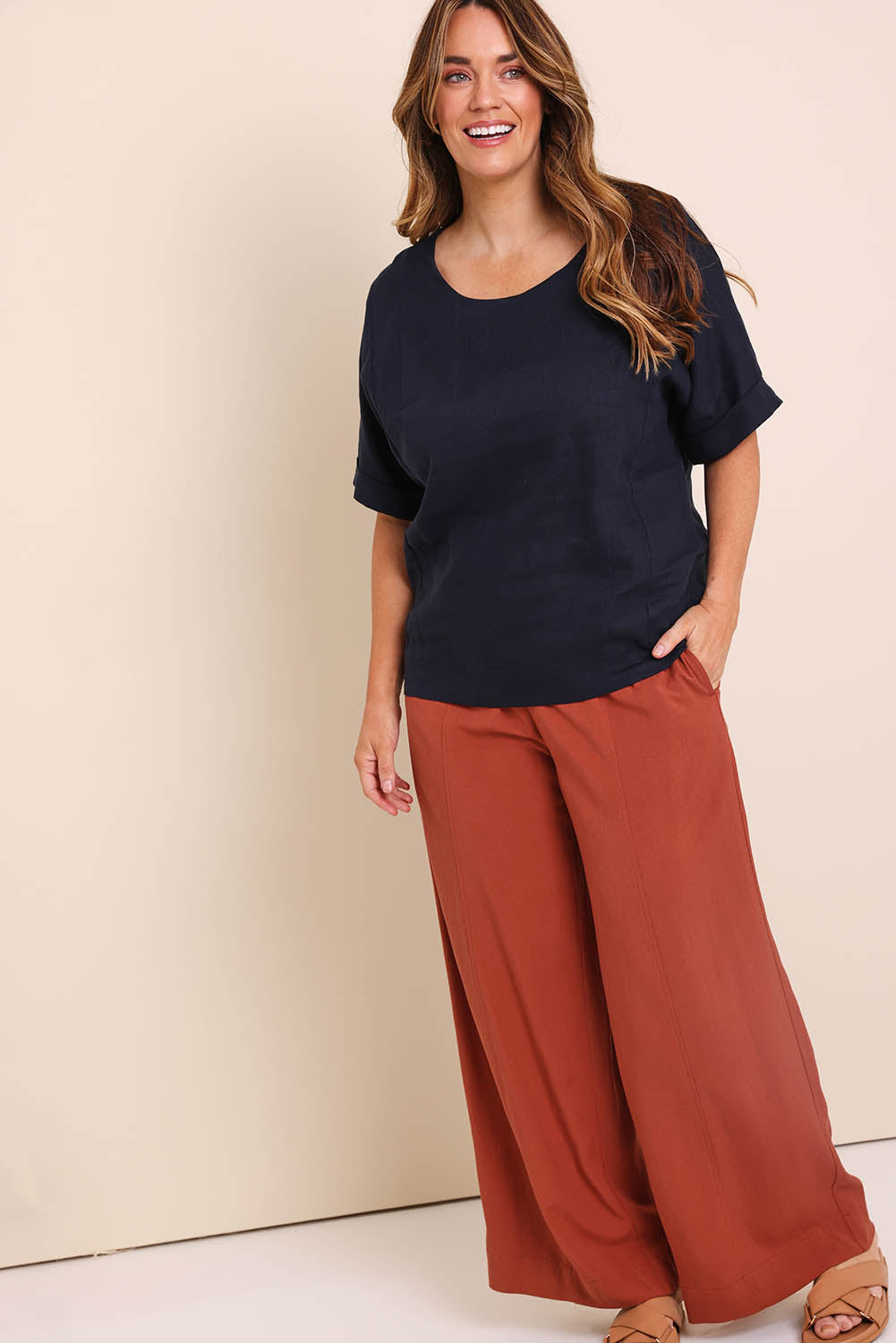Model Lauraw wearing size 14 of the Belle Wear Anywhere Pants  - Sienna in colour Sienna, from the front