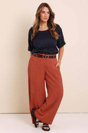 Model Lauraw wearing size 14 of the Belle Wear Anywhere Pants  - Sienna in colour Sienna, from the front