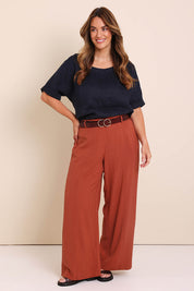 Model Lauraw wearing size 14 of the Belle Wear Anywhere Pants  - Sienna in colour Sienna, from the front