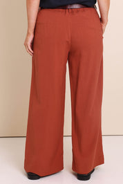 Model Lauraw wearing size 14 of the Belle Wear Anywhere Pants  - Sienna in colour Sienna, from the front