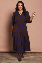 Model Ashleigh wearing size 16 of the Belle Luxe Ecovero Printed Tiered Dress in colour Cobaltcoco (Blue), from the front, showing the whole outfit