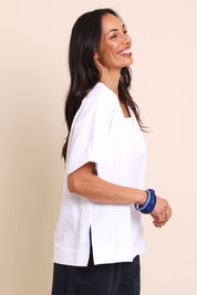 Model Amandam wearing size 10 of the Belle Wear Anywhere Woven Tee  - White in colour White, from an angle