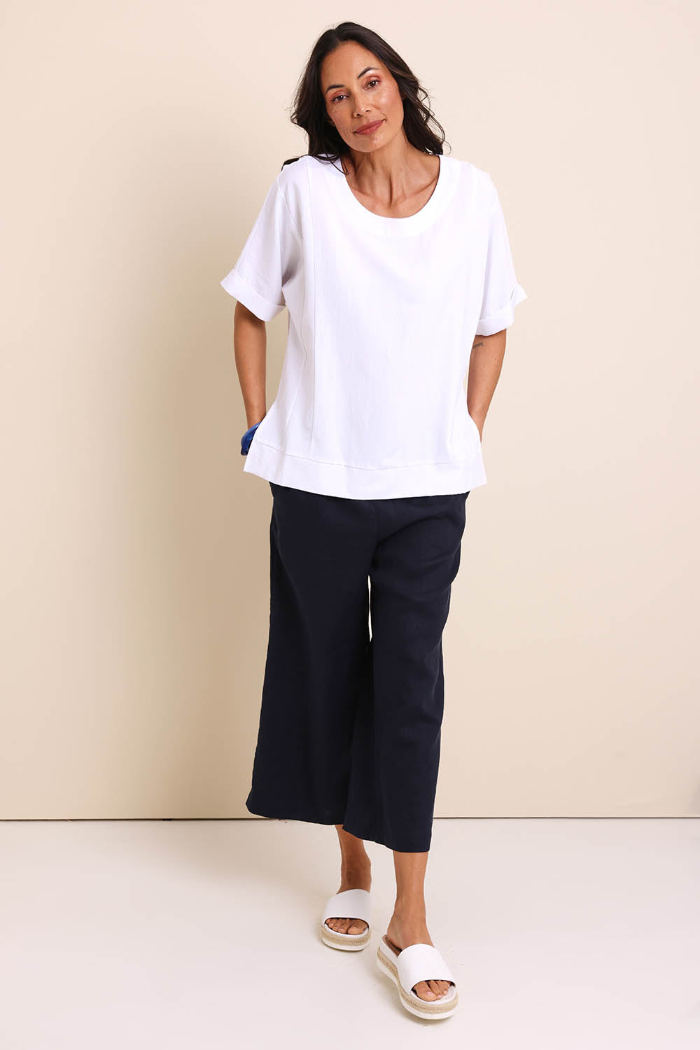 Model Amandam wearing size 10 of the Belle Wear Anywhere Woven Tee  - White in colour White, from the front