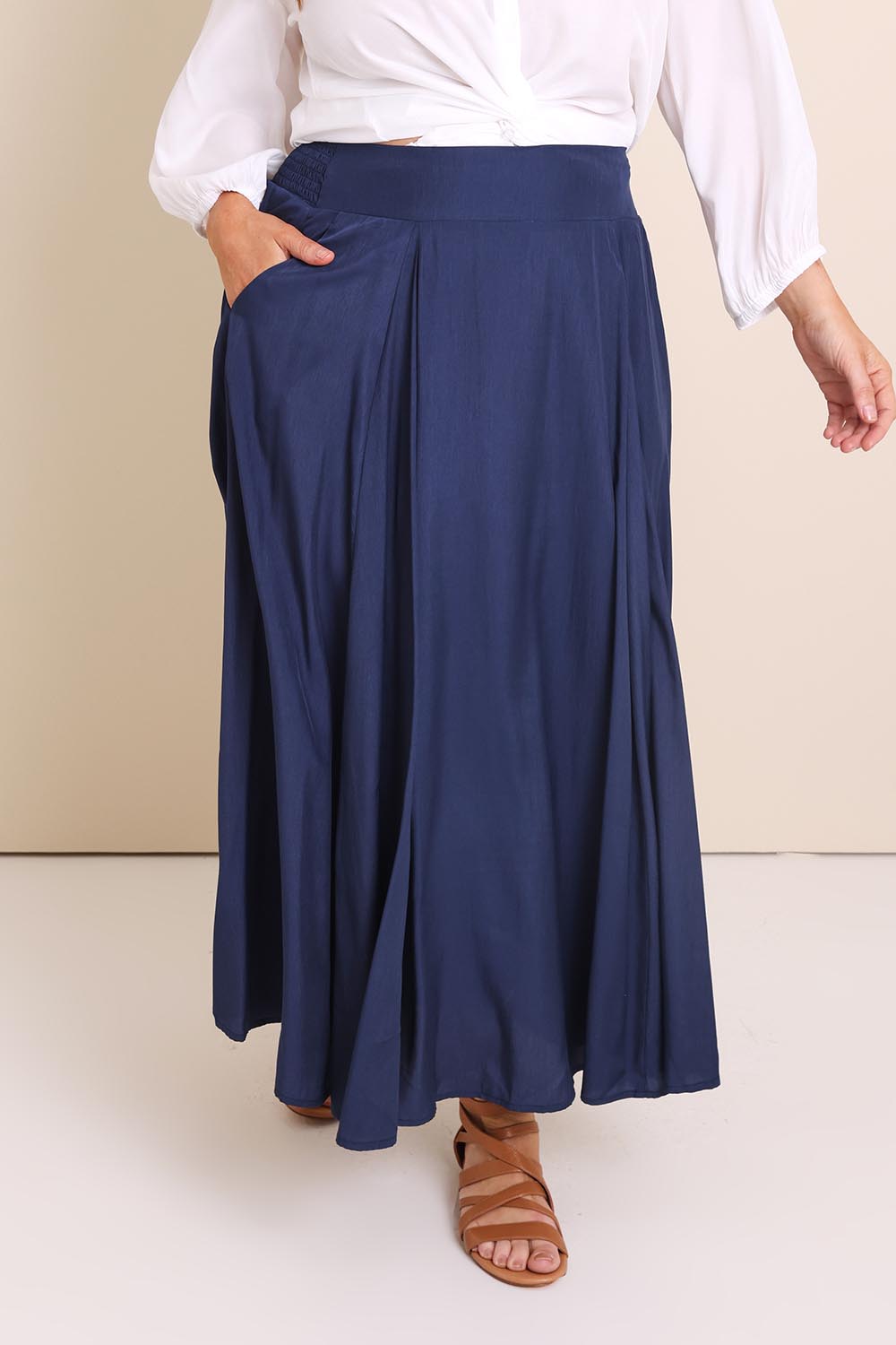 Model Lauraw wearing size 14 of the Belle Easy Wear Every Wear  Skirt  - Navy in colour Navy, in a cropped view