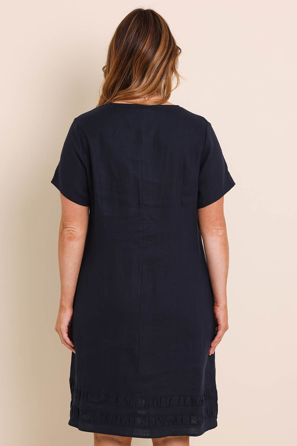 Model Lauraw wearing size 14 of the Belle Easy Wear Linen Panelled Dress – Navy in colour Navy, from the back