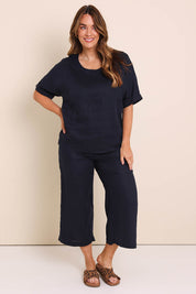 Model Lauraw wearing size 14 of the Belle Easy Wear Linen Scoop Tee – Navy in colour Navy, from the front
