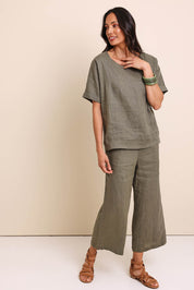 Model Amandam wearing size 10 of the Belle Easy Wear Linen Scoop Tee – Olive in colour Olive, from the front