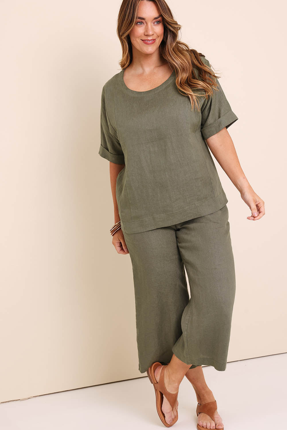 Model Lauraw wearing size 14 of the Belle Easy Wear Linen Scoop Tee – Olive in colour Olive, from the front