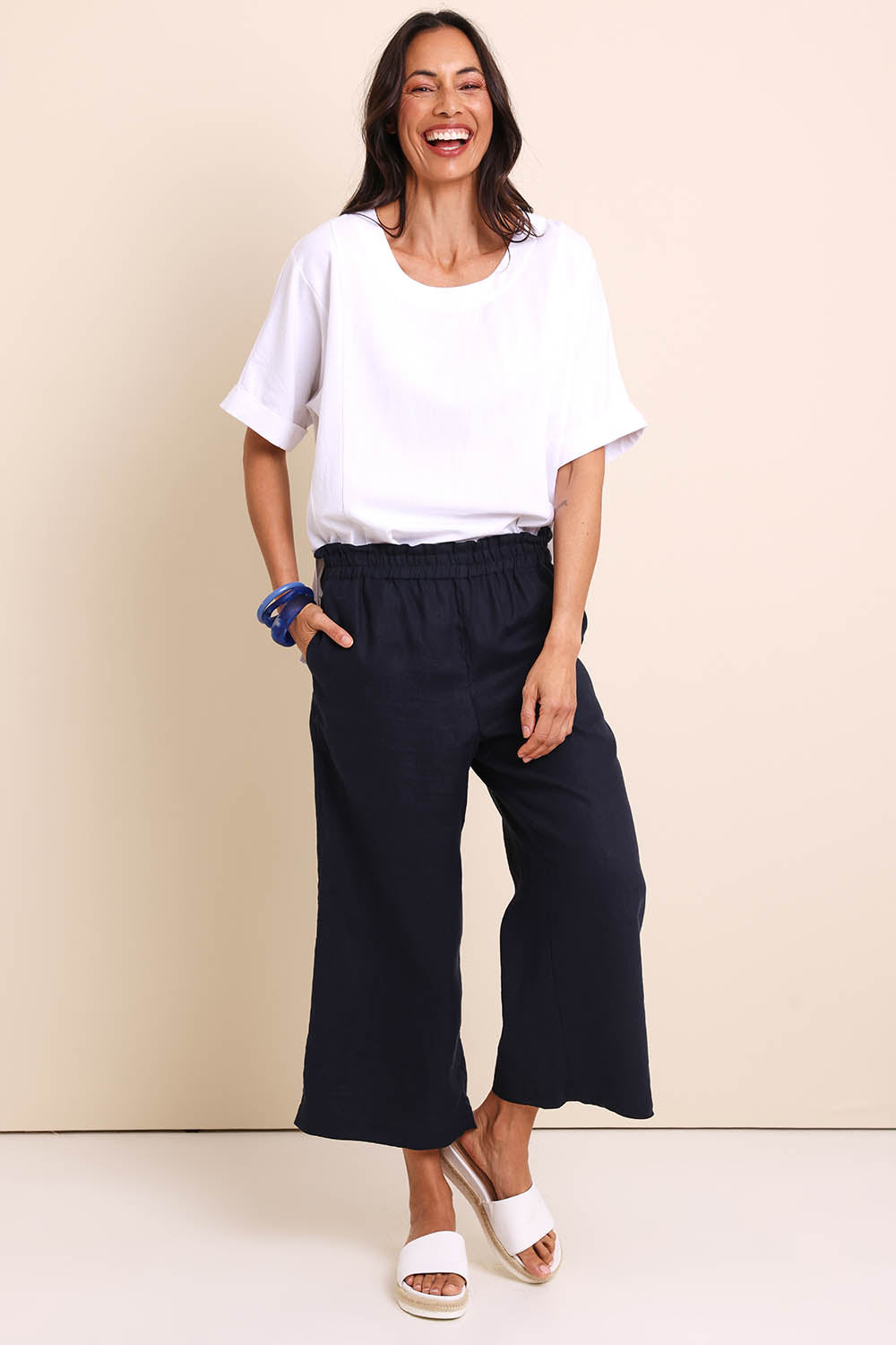 Model Amandam wearing size 10 of the Belle Easy Wear Linen Pant – Navy in colour Navy, from the front