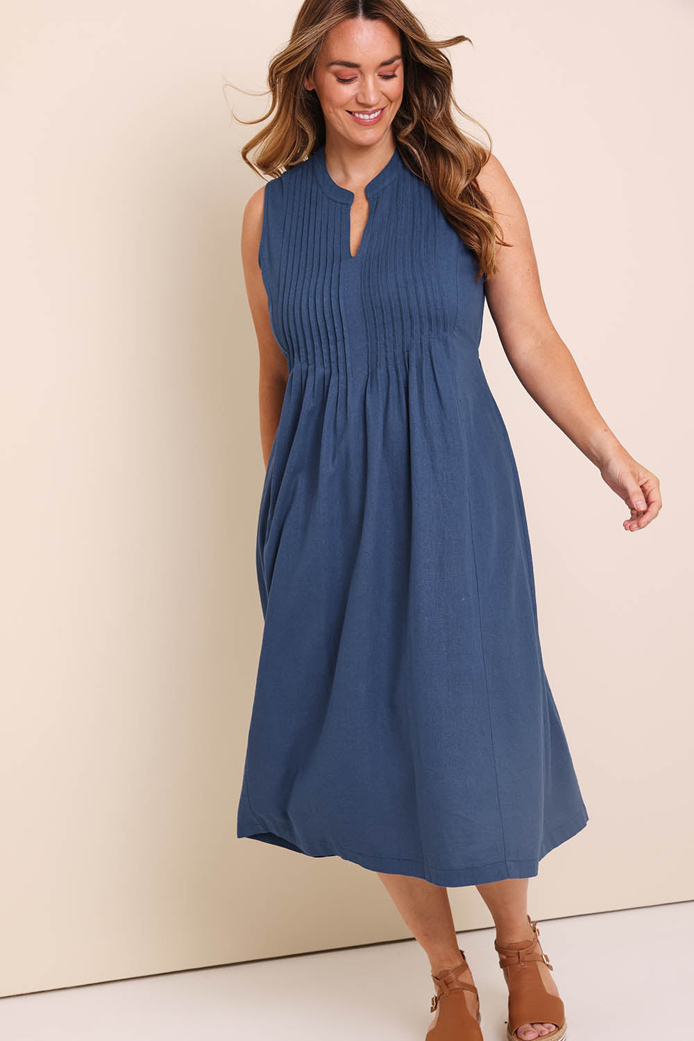 Model Lauraw wearing size 14 of the Belle Pintucked Midi Dress with Pockets - Sea blue in colour Sea Blue, from the front