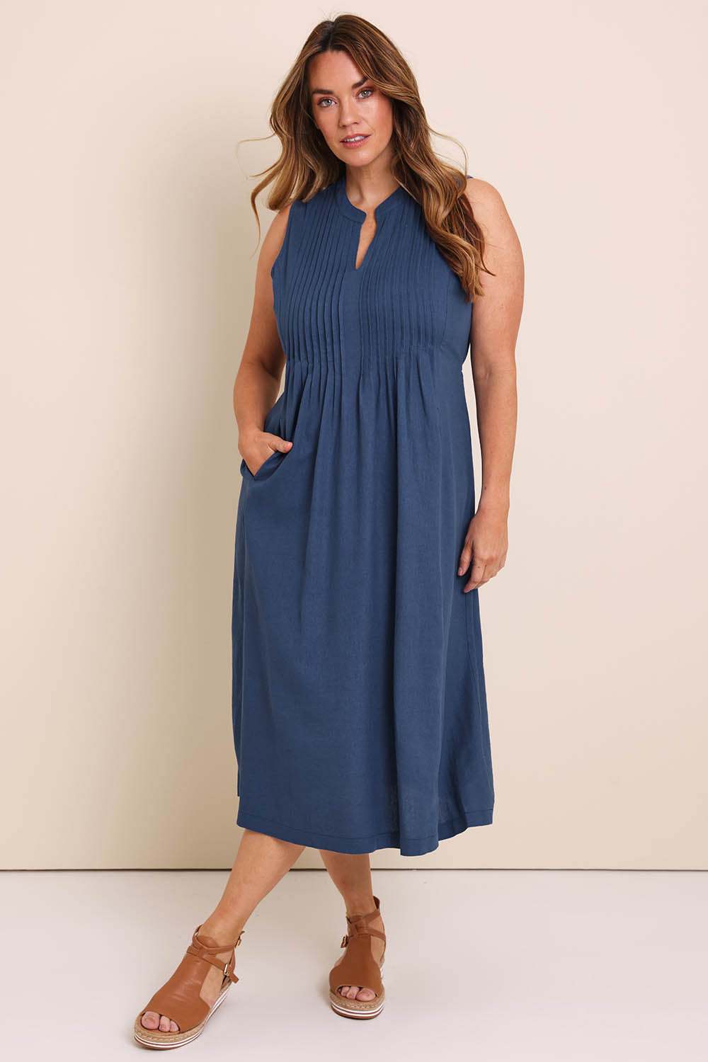 Model Lauraw wearing size 14 of the Belle Pintucked Midi Dress with Pockets - Sea blue in colour Sea Blue, from the front