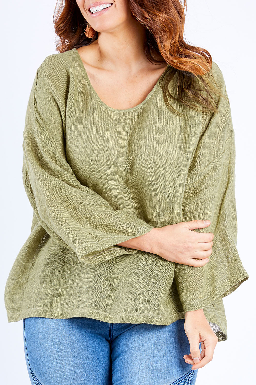 Model Laura wearing size 14 of the Sheer Delight Linen Knit Throw Top in colour Olive (Green), from the front, cropped image
