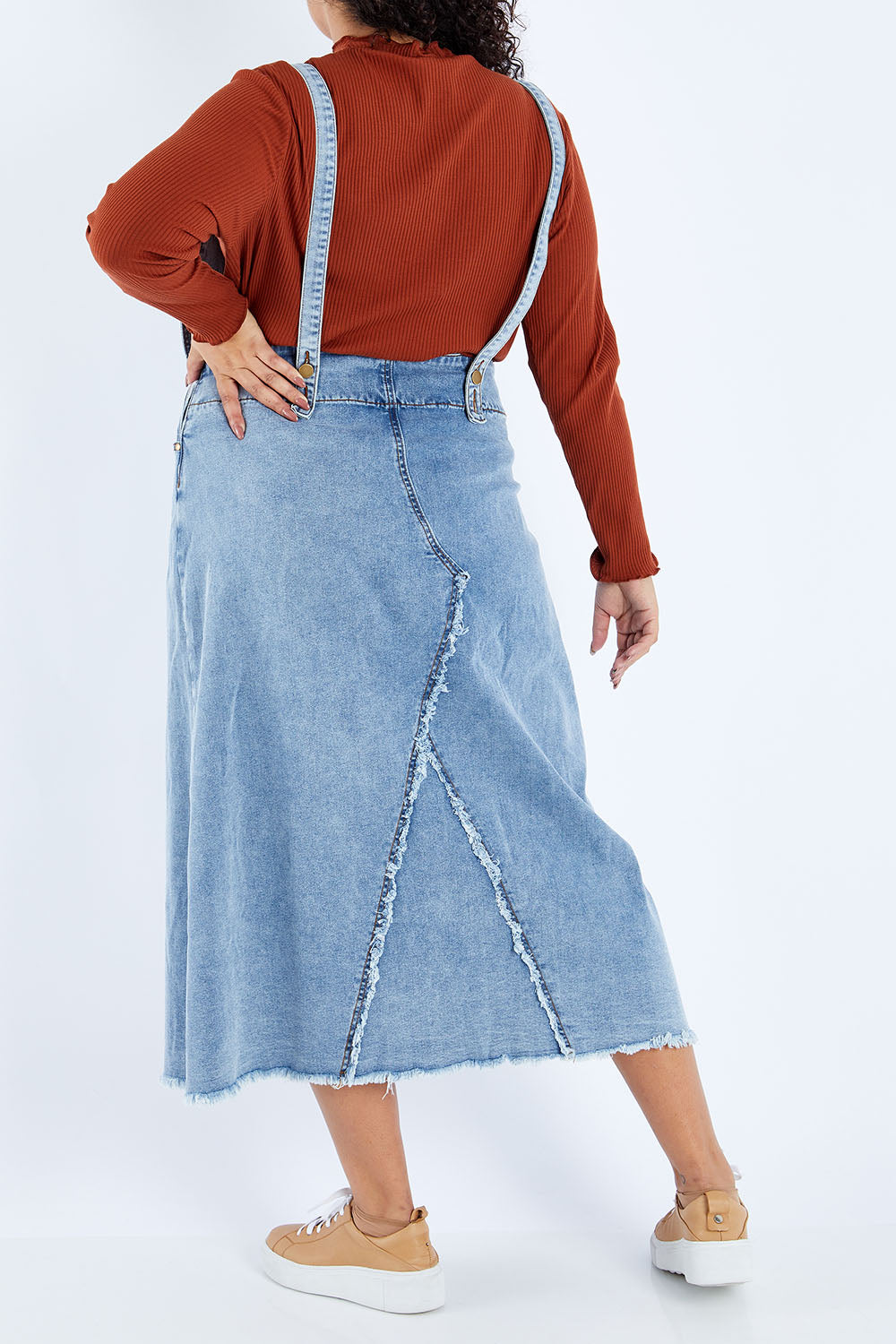 Model Sasha-Lee wearing size 16 of the Happy Me Denim Pinny in colour Denim (Blue), from the back