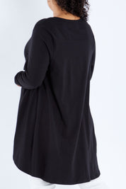 Model Sasha-Lee wearing size 16 of the Sunshine In Me Long Sleeve Tee in colour Black (Black), from the back