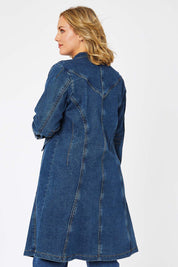 Model Jess wearing size 14 of the Attention To Me Denim Jacket in colour Denim (Blue), from the back