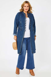 Model Jess wearing size 14 of the Attention To Me Denim Jacket in colour Denim (Blue), from the front, showing the whole outfit