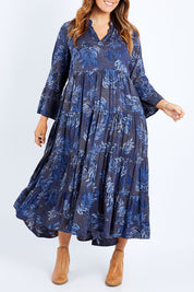 Model Laura wearing size 14 of the Its Easy Loving You Tiered Dress in colour Bluefleur (Blue), from the front, cropped image