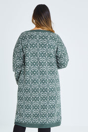 Model Palatina wearing size XL of the Fields Of Folly Cardi in colour Forest (Green), from the back