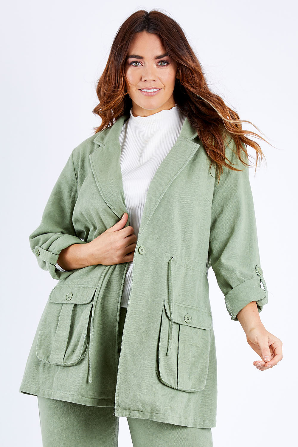 Model Laura wearing size 14 of the Chill Out Calling Jacket in colour Khaki (Green), from the front, cropped image