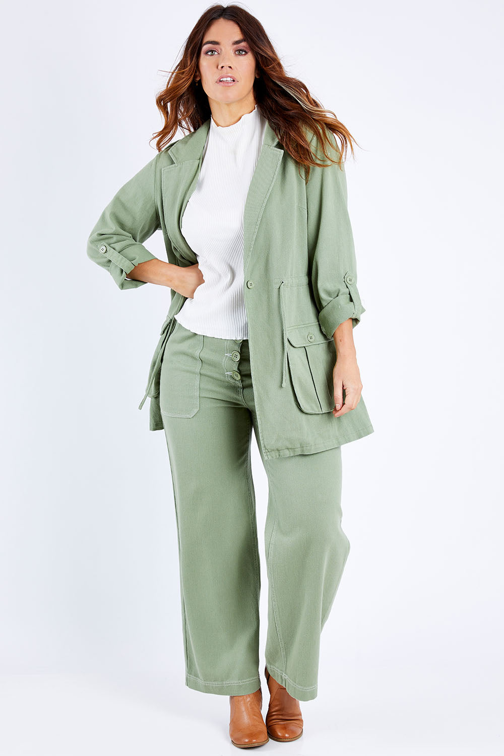 Model Laura wearing size 14 of the Chill Out Calling Jacket in colour Khaki (Green), from the front, showing the whole outfit