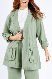 Model Laura wearing the Chill Out Calling Jacket in colour Khaki (Green), from the front, cropped image