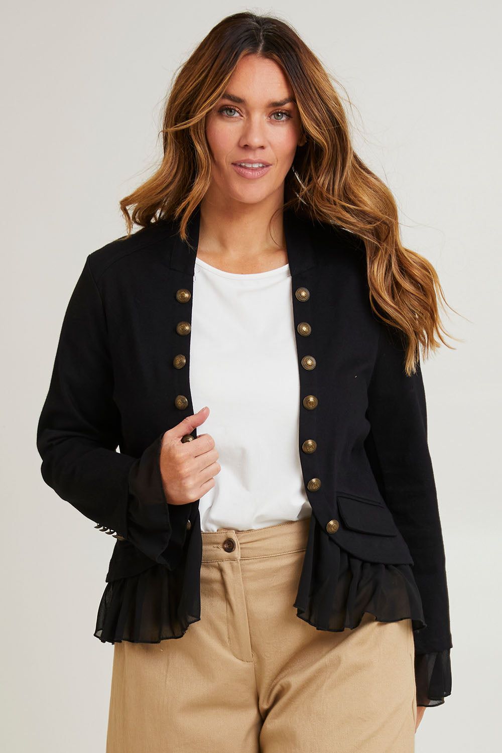 Model Laura wearing size 14 of the Commander Of Love Jacket in colour Black (Black), from the front, cropped image