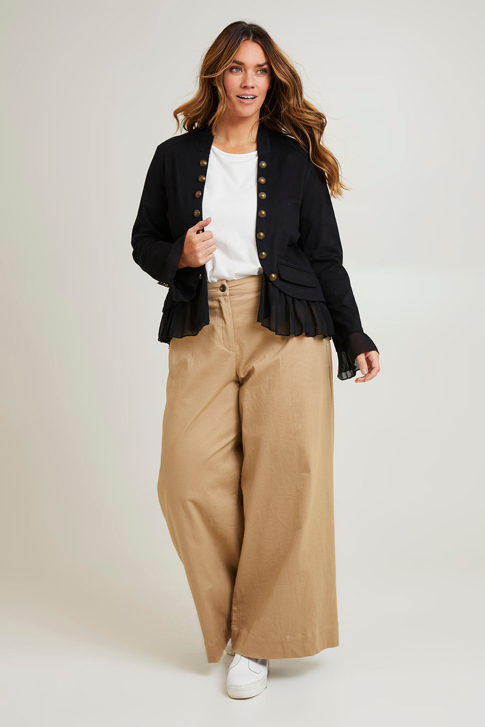 Model Laura wearing size 14 of the Commander Of Love Jacket in colour Black (Black), from the front, showing the whole outfit