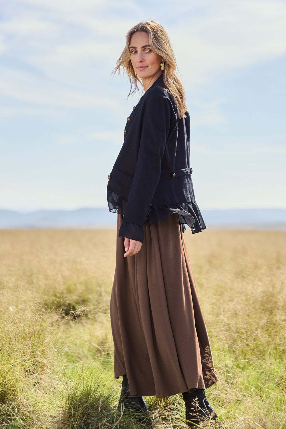 Model Tegan wearing size 10 of the Commander Of Love Jacket in colour Black (Black), from the front, showing the whole outfit