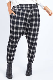 Model Laura wearing size 14 of the Check Me Out Pants in colour Black (Black), from the front, cropped image