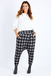 Model Laura wearing size 14 of the Check Me Out Pants in colour Black (Black), from the front, showing the whole outfit