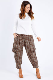 Model Laura wearing size 14 of the Tied To You Comfort Pants in colour Leopard, from the front, showing the whole outfit