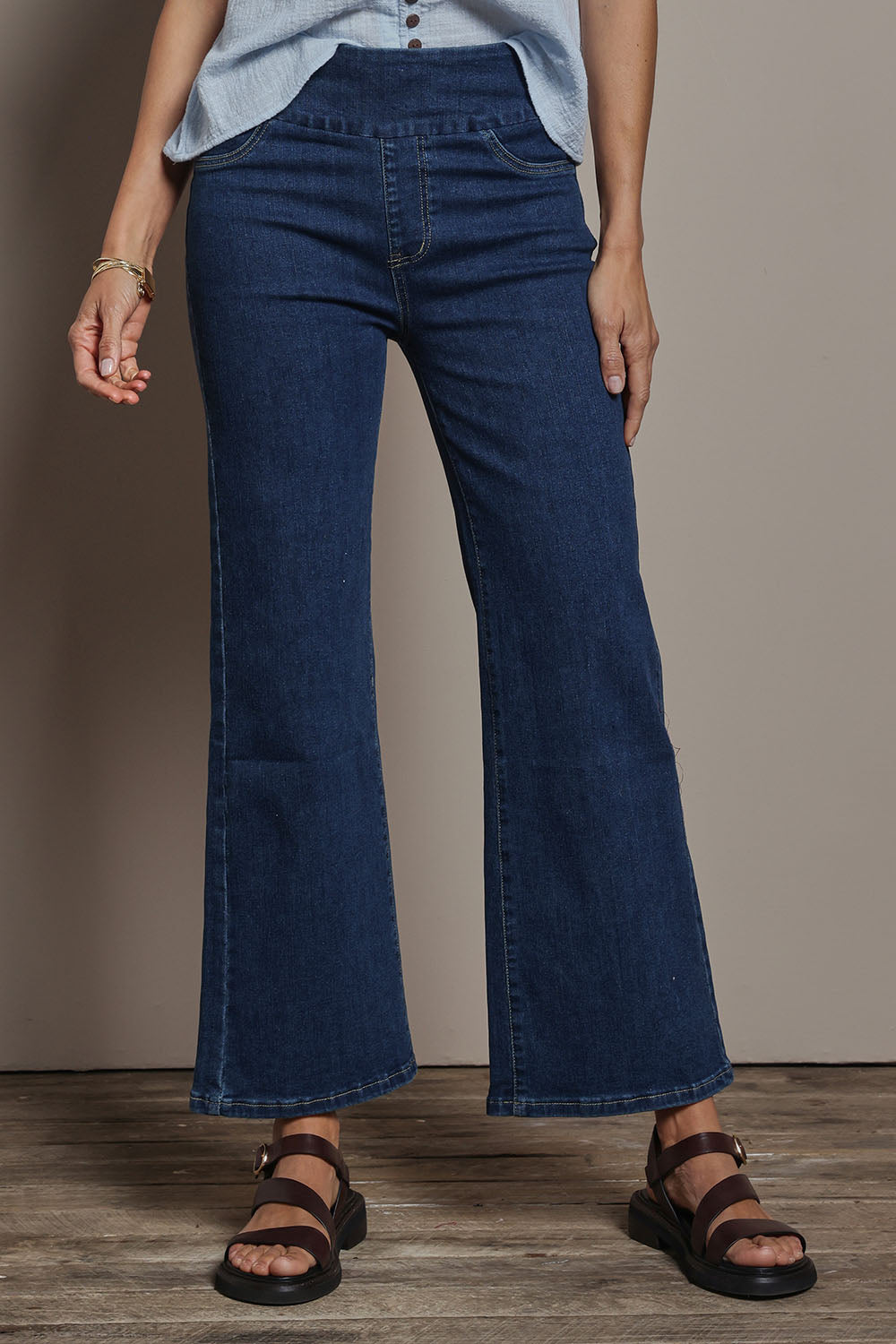 Model Amanda wearing size 10 of the Easy As Plain Pull On Jeans in colour Darkdenim (Blue), from the front, cropped image