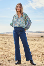 Model Tegan wearing size 10 of the Easy As Plain Pull On Jeans in colour Darkdenim (Blue), from the front, showing the whole outfit