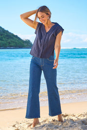 Model Tegan wearing size 10 of the Easy As Plain Pull On Jeans in colour Darkdenim (Blue), from the front, showing the whole outfit
