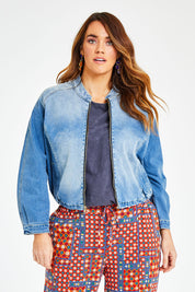 Model Laura wearing size 14 of the Give Me Wings Denim Jacket in colour Denim (Blue), from the front, cropped image