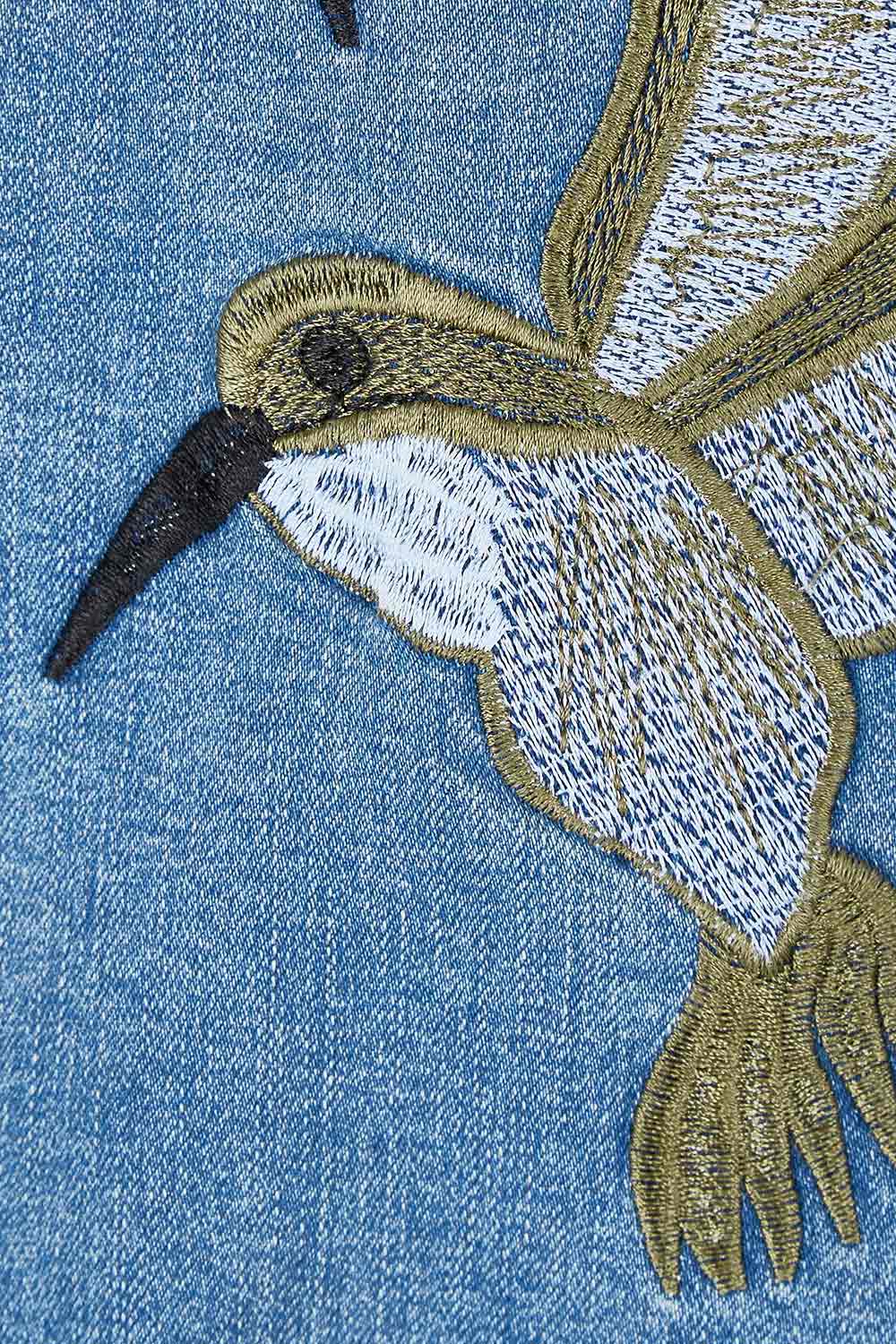 Product shot of the Give Me Wings Denim Jacket in colour Denim (Blue), detail