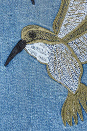 Product shot of the Give Me Wings Denim Jacket in colour Denim (Blue), detail